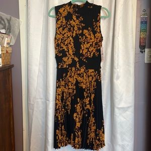 Nanette Lepore women’s size 12 black and orange floral dress. New with tags.